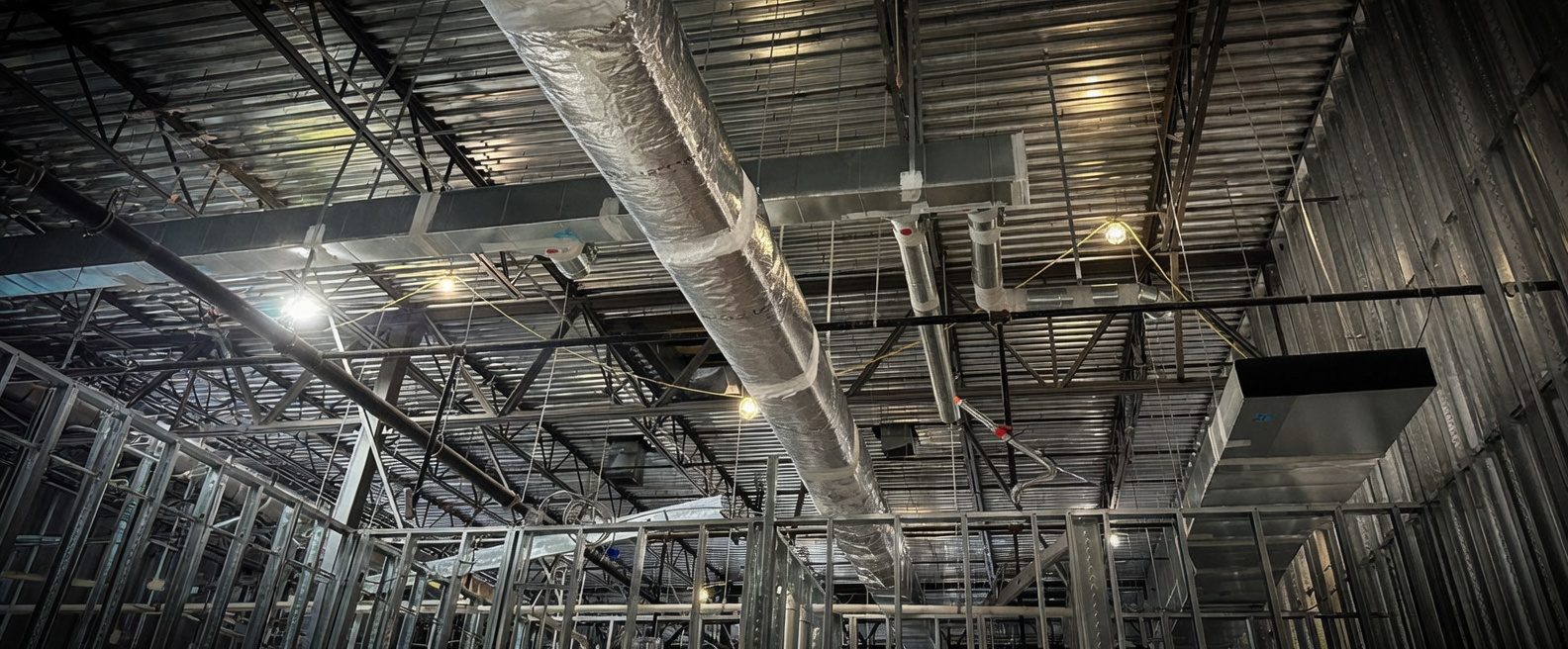 Commercial mechanical installation — overhead ductwork in a Florida commercial building