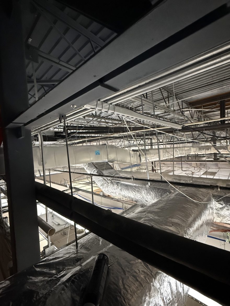 SGC Mechanical commercial installation — structural steel and overhead mechanical systems